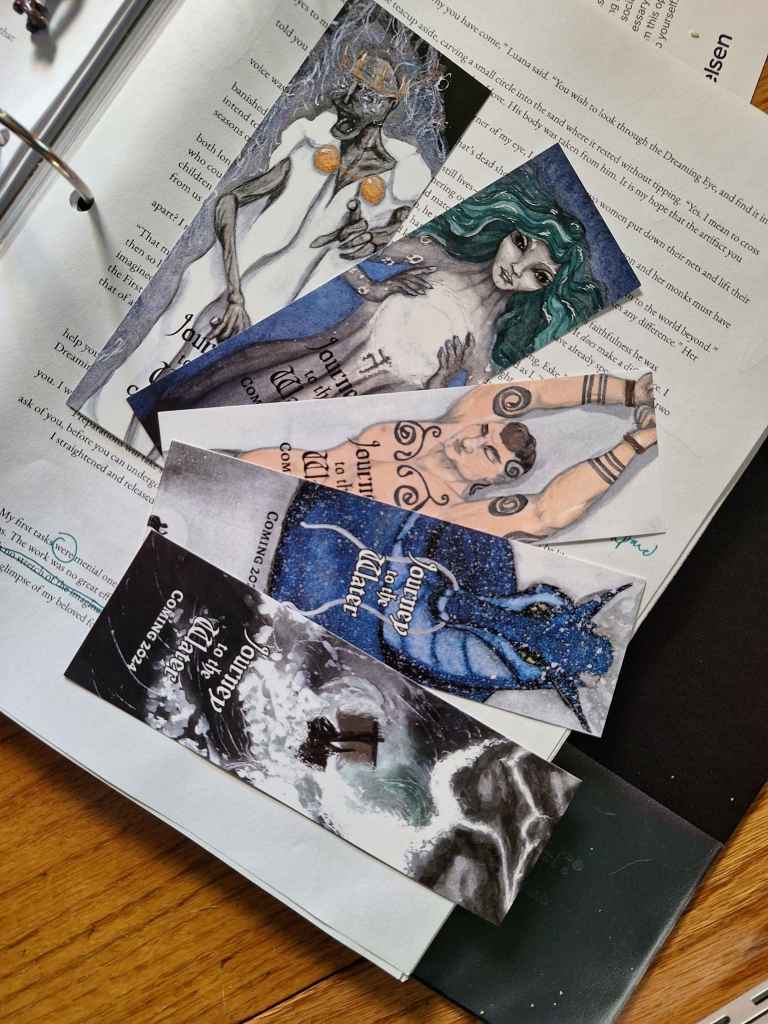 Five painted bookmarks from Journey to the Water: Undead king, whale mermaid goddess, Eske chained to the rock, the dragon on the mountain, and a ship in a storm.